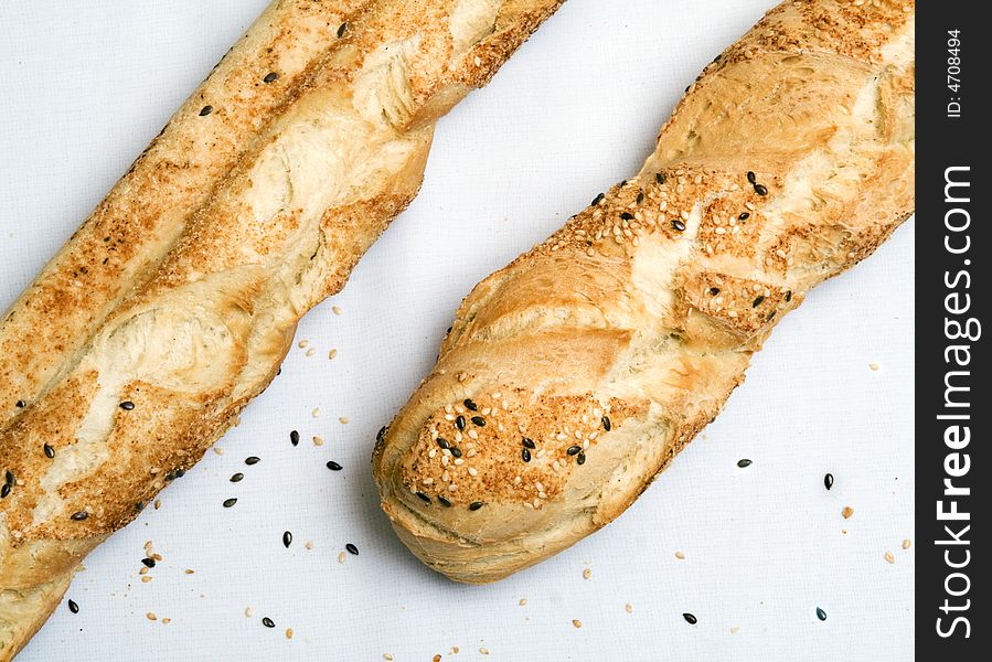 Two baguettes laying on a table