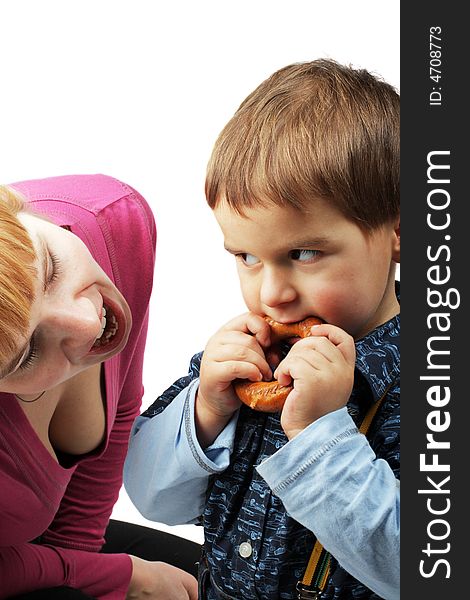 Mom and her son eating one bagel on white background