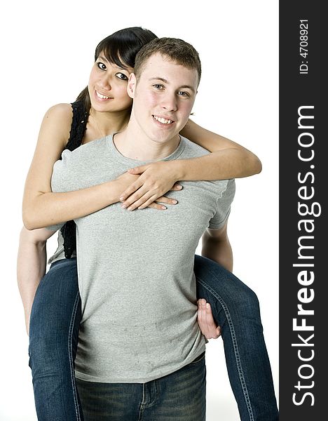 A young couple in love having a piggyback ride. A young couple in love having a piggyback ride