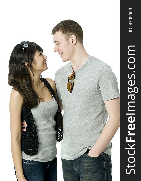 A young couple together in the studio with sunglasses on. A young couple together in the studio with sunglasses on