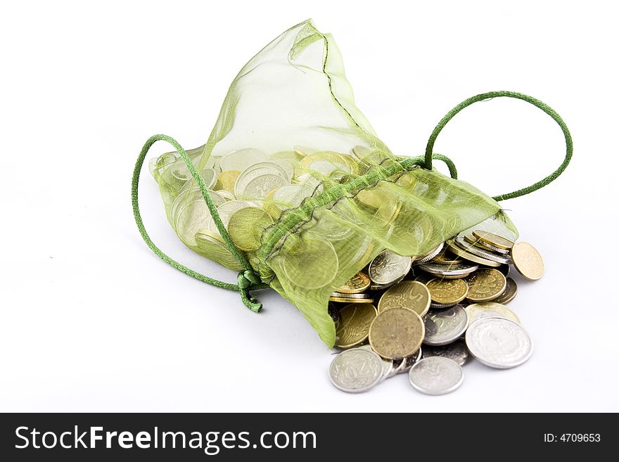 Coins in a green pouch. Coins in a green pouch