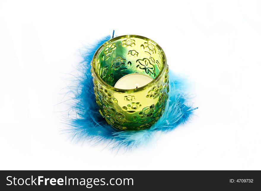 Green candlestick and blue plumage background