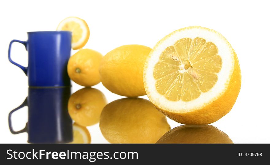 Diagonal shot of a lemons and blue mug