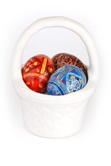 Three Easter Eggs In White Basket Over White Royalty Free Stock Photos
