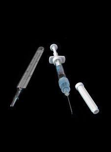 Medical Syringe And Thermometer Isolated On Black Stock Photo Medical Syringe And Thermometer Isolated On Black Stock Photo