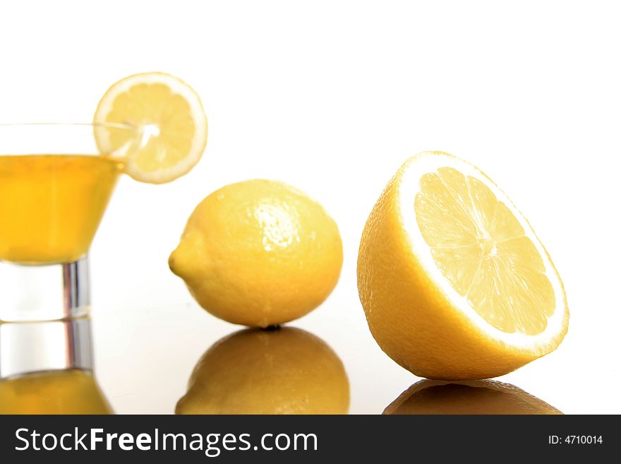 Fresh lemonade in cup with lemons beside. Fresh lemonade in cup with lemons beside