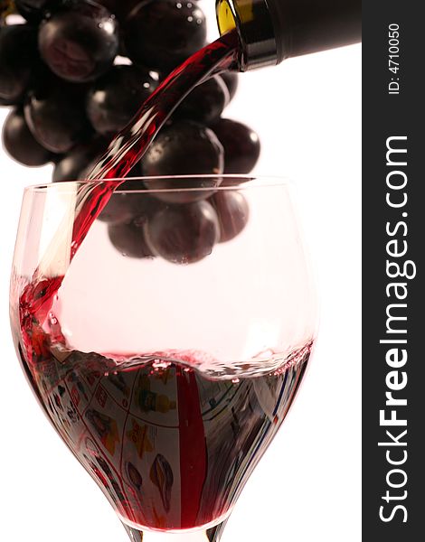 Red wine with a bottle on a withe background.