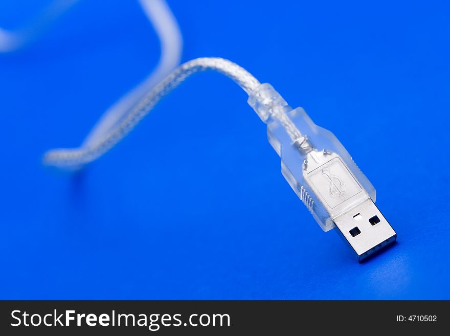 Transparent USB Cable against the blue background