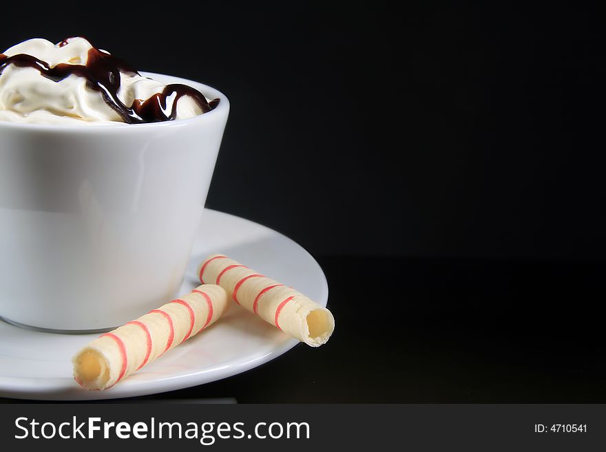 Macro shot of coffee with topping and chocolate. Macro shot of coffee with topping and chocolate