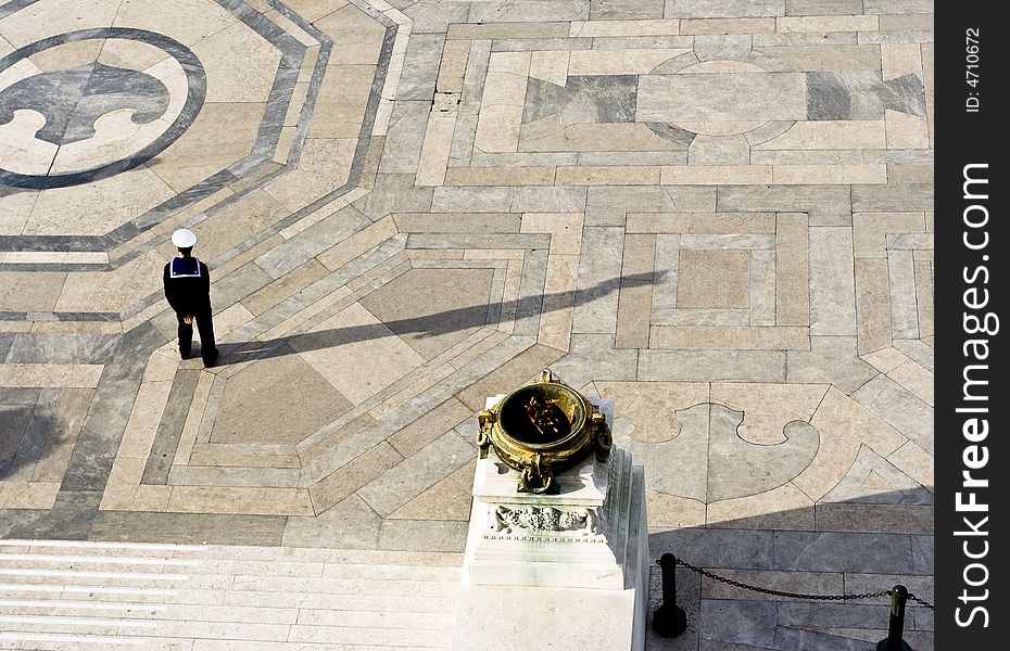 A soldier standing at a monument