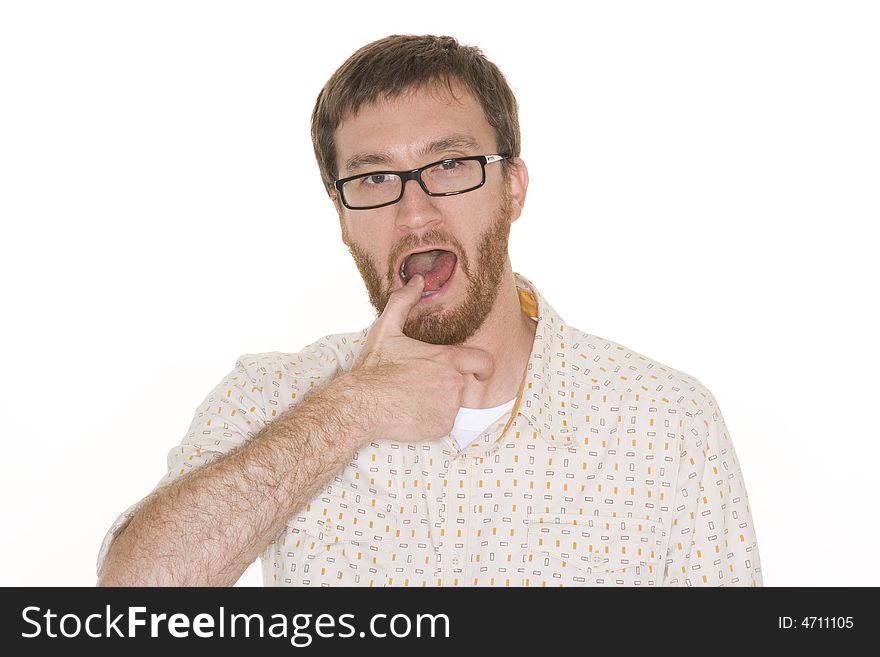 Man with beard framed from the chest up puts his thumb in his mouth.  Photographed against a white background. Man with beard framed from the chest up puts his thumb in his mouth.  Photographed against a white background.