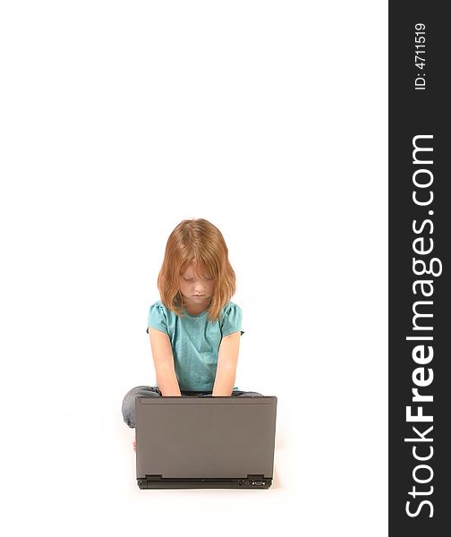 Isolated young girl using a laptop