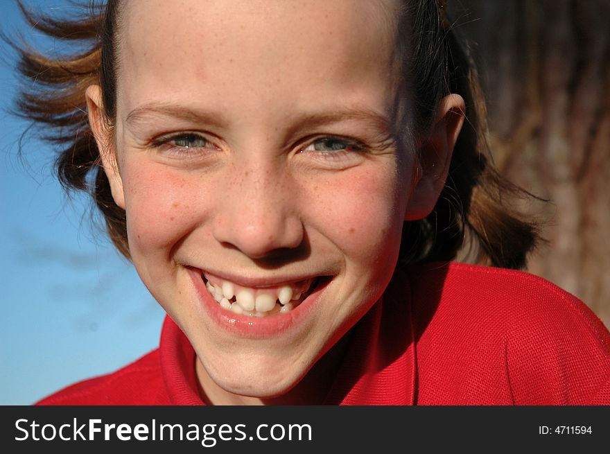 Little girl's cheeky smile