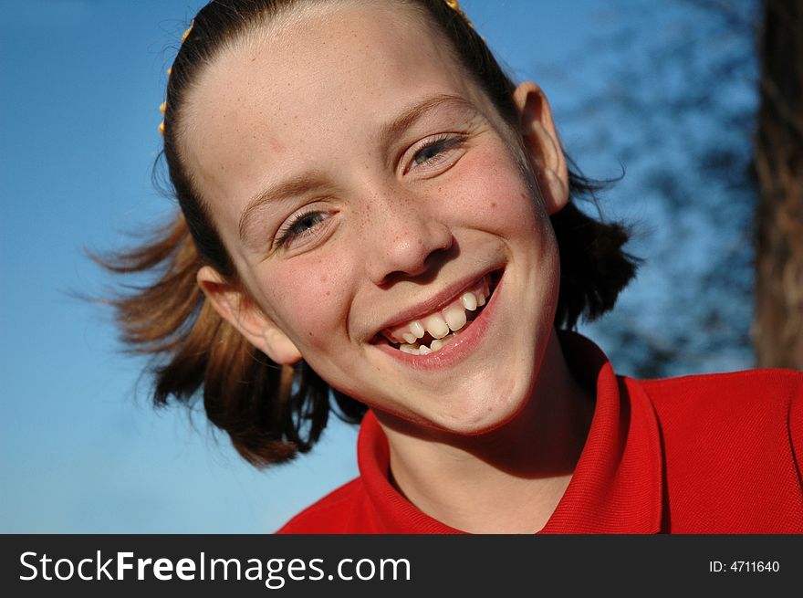 Little girl's cheeky smile