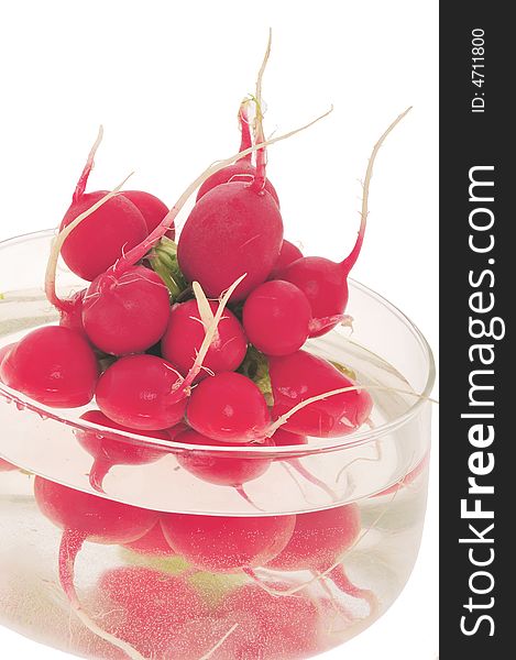 Nice, fresh, red radishes in water glass bowl. Nice, fresh, red radishes in water glass bowl