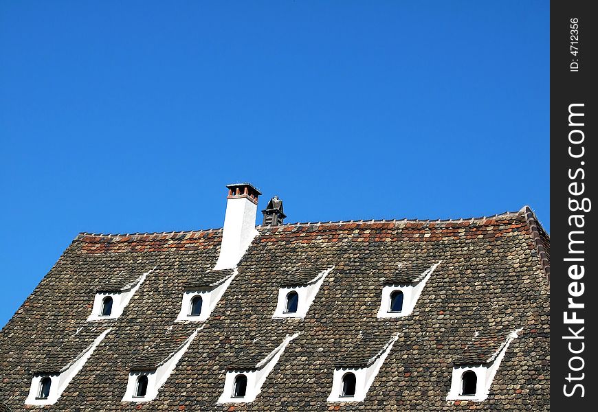 Historic Traditional Normandy roof of a house in a French village. Historic Traditional Normandy roof of a house in a French village