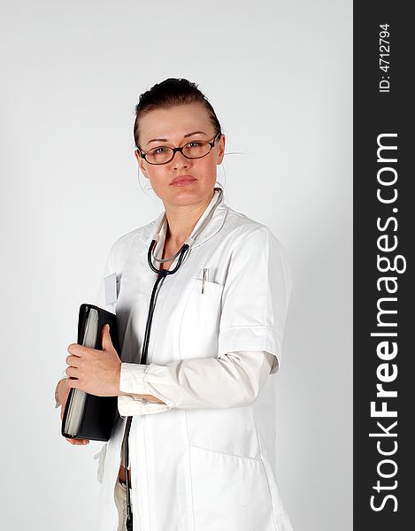 Attractive brunette woman in medical uniform. Attractive brunette woman in medical uniform