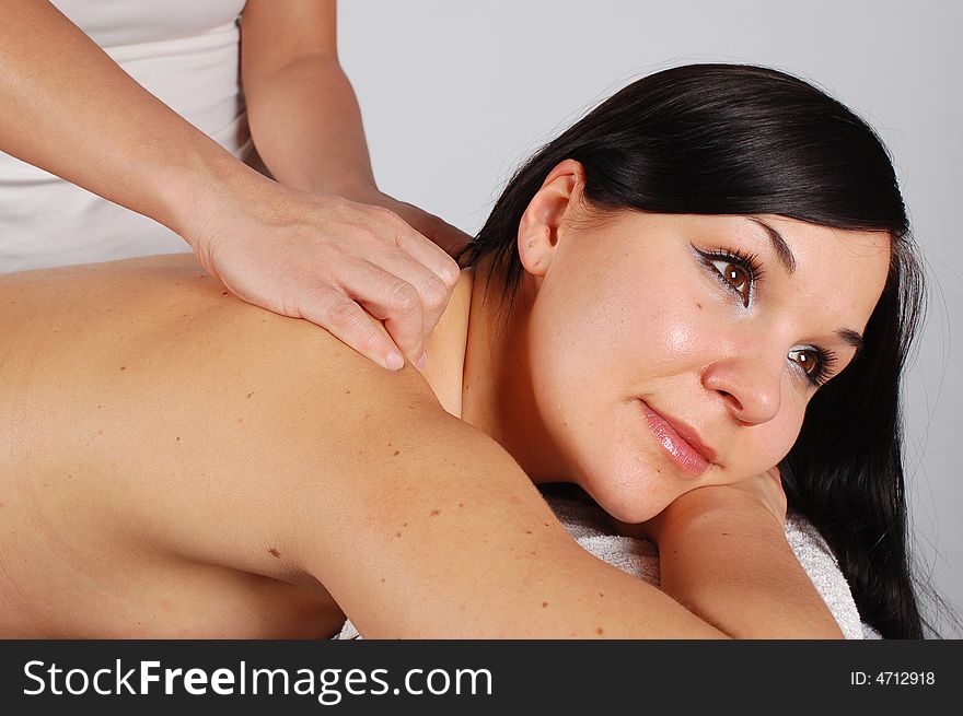 Attractive brunette woman relaxing in massage