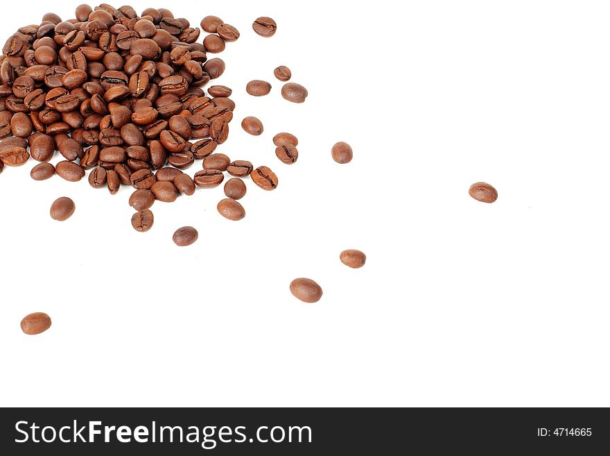Coffee beans on white at left up