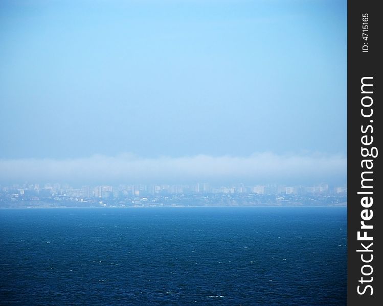 Buildings under the clouds in the sea