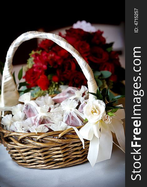 A basket full of flower petals during a wedding. A basket full of flower petals during a wedding