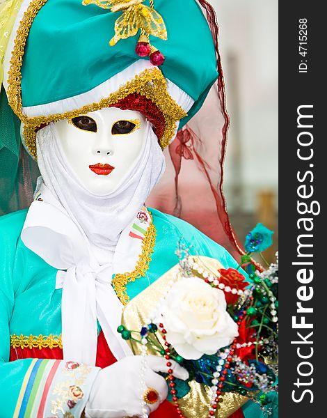 Colorful turquoise costume at the Venice Carnival. Colorful turquoise costume at the Venice Carnival