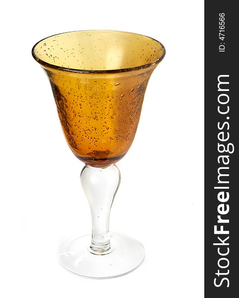 Big yellow wineglass isolated with white background