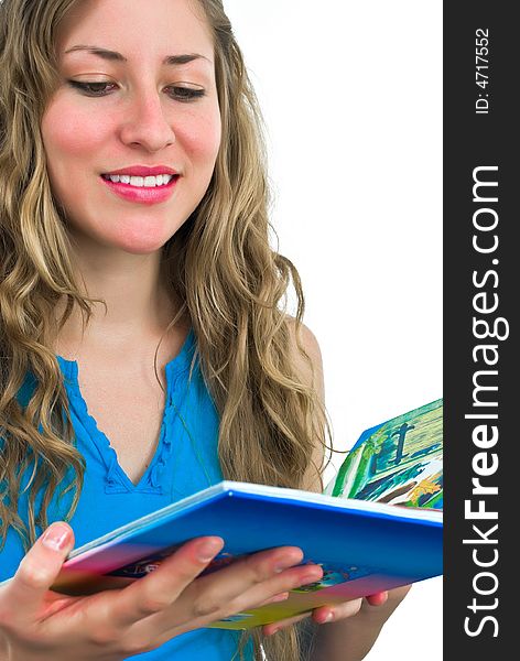 Smiling young adorable woman with a colorful book