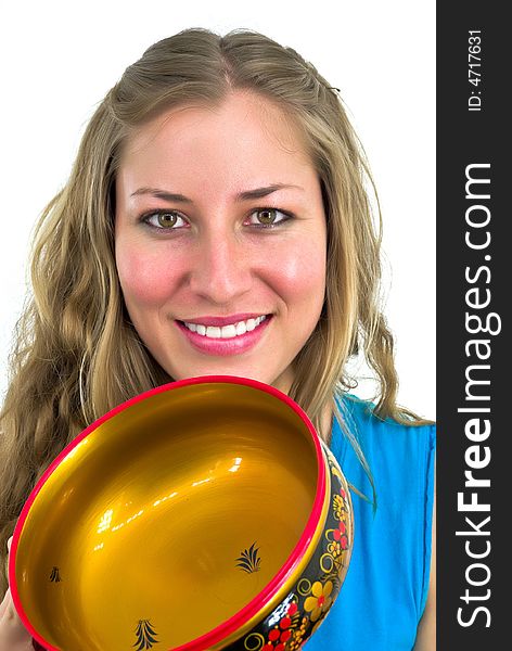 Young pretty woman with a multicolor wooden bowl. Young pretty woman with a multicolor wooden bowl