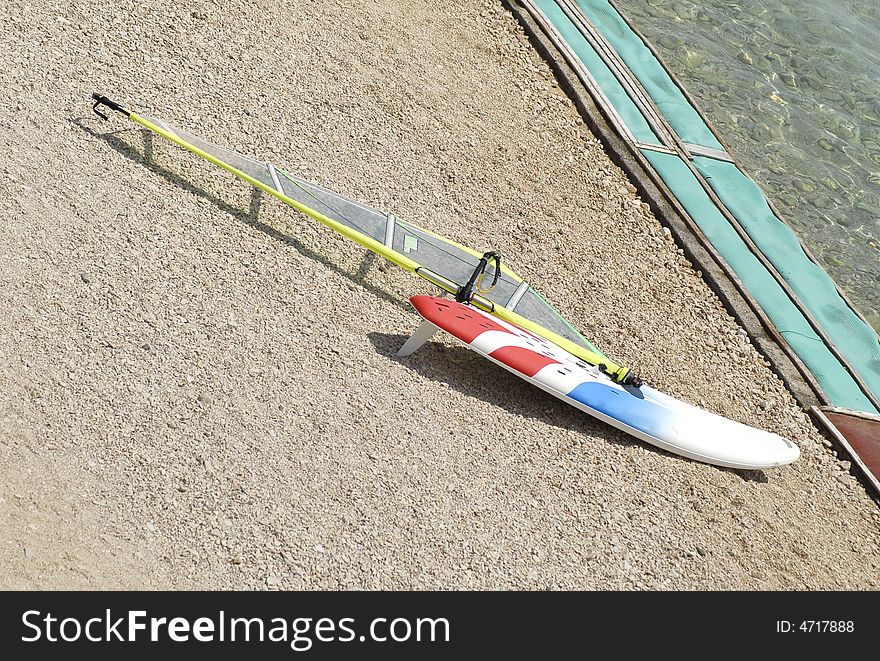 Wind surfing boat parked on the beach