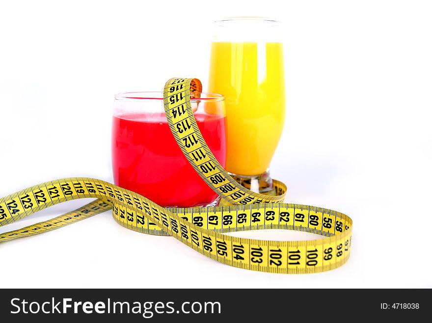 Juice and measuring tape on white background. Juice and measuring tape on white background.