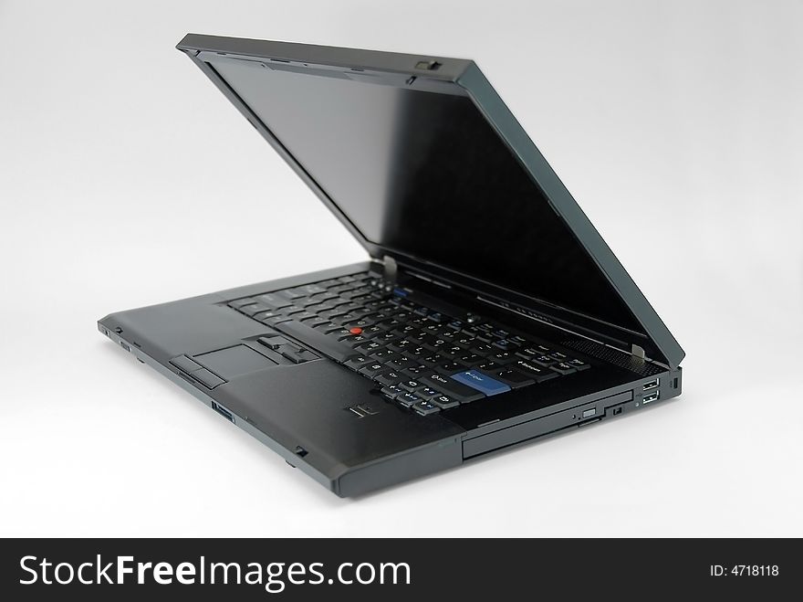 Modern black notebook computer on white background