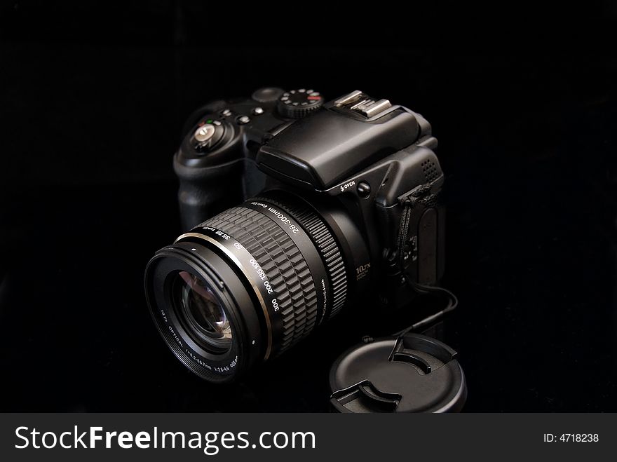 Modern profesionalny camera SLR on the black background