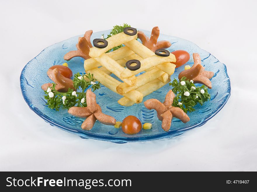 Funny potato chips arranged nicely on a plate for children to have fun.