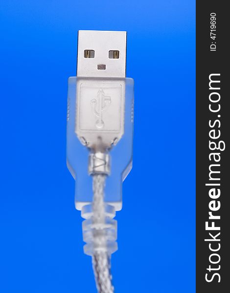 Transparent USB Cable with 'face' against the blue background.