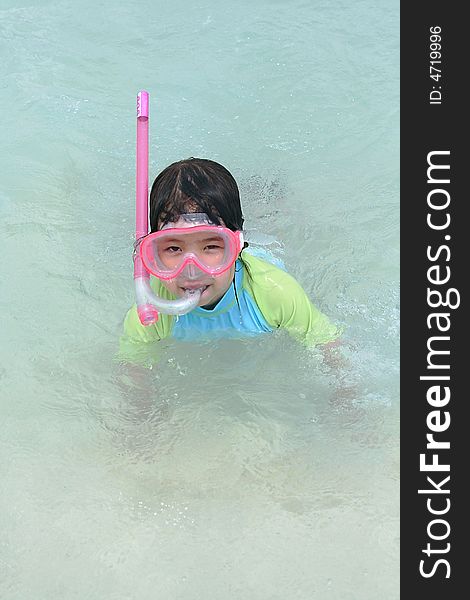 Girl plays in blue ocean water. Girl plays in blue ocean water