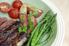 Steak With Potatoes, Tomatoes, And Asparagus Stock Photography Steak With Potatoes, Tomatoes, And Asparagus Stock Photography