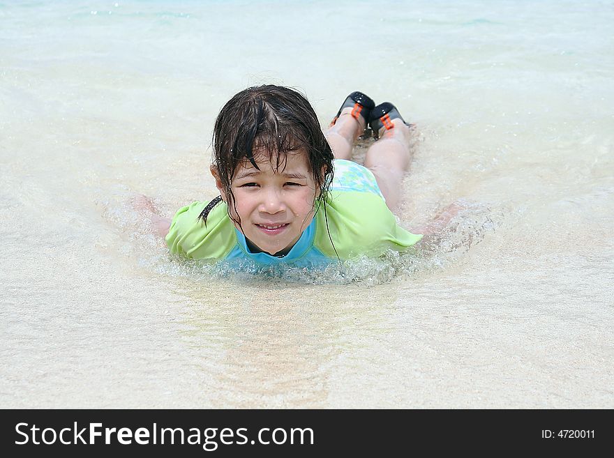 Girl plays in ocean