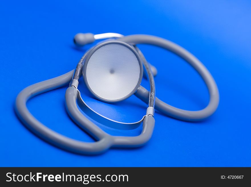 Stethoscope against the blue background.