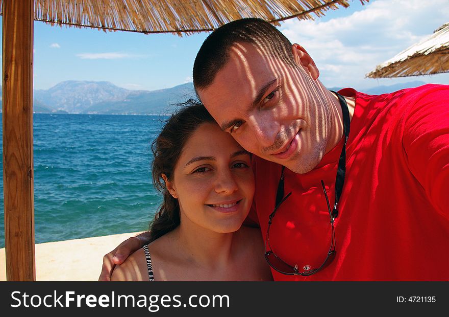 Couple on the beach smiling