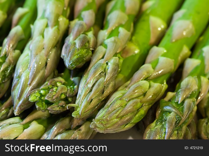 Freshly washed still dripping with water close up of asparagus. Freshly washed still dripping with water close up of asparagus