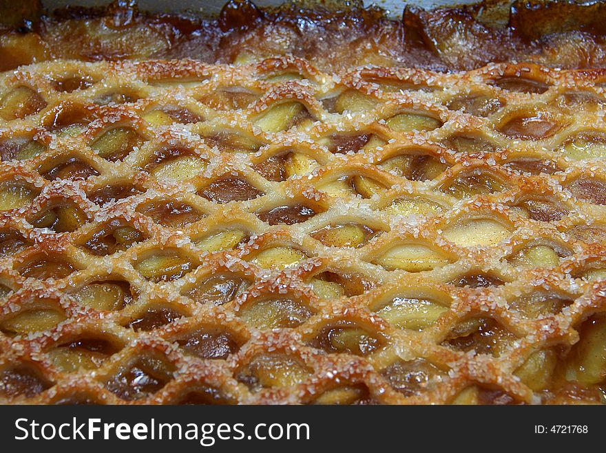 Closeup detail of lattice apple pie crust with sugar granules. Closeup detail of lattice apple pie crust with sugar granules