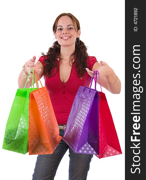 Young woman holding a few colorful shopping bags - over a white background