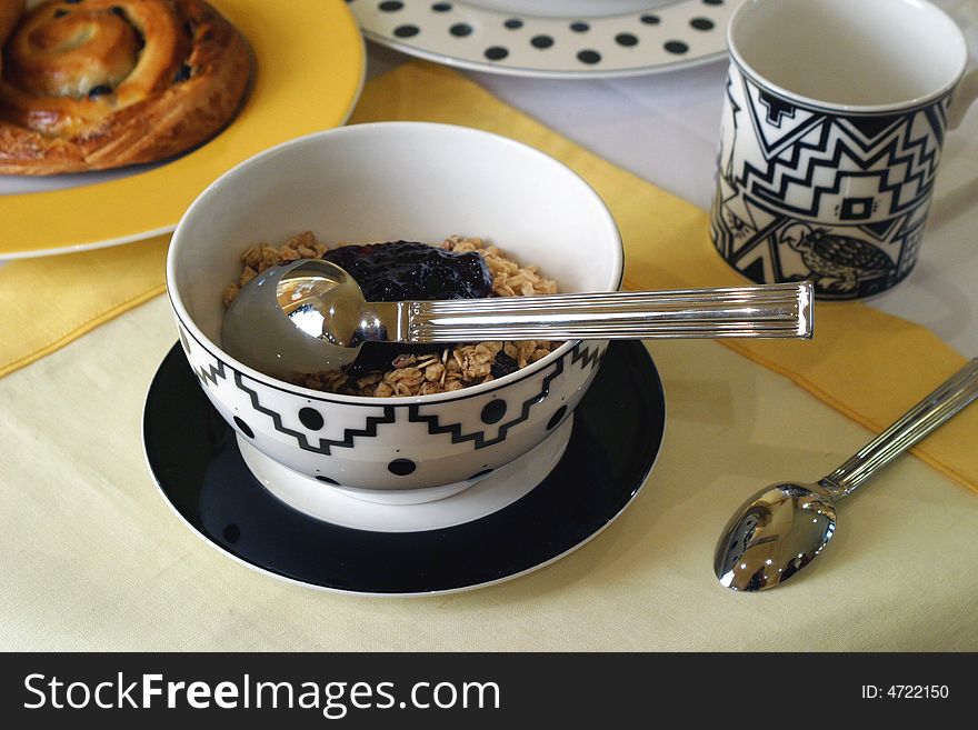 Breakfast table prepared for guests at a bed and breakfast place. Breakfast table prepared for guests at a bed and breakfast place.