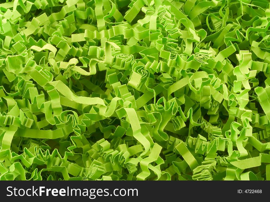 Here is a background made entirely of strips of crinkled green paper. Here is a background made entirely of strips of crinkled green paper.