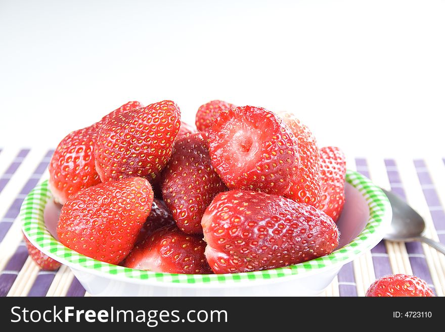 You have fresh strawberries in the bowl