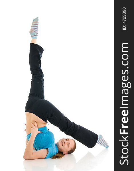 The beautiful young woman doing yoga exercise isolated on a white background. The beautiful young woman doing yoga exercise isolated on a white background