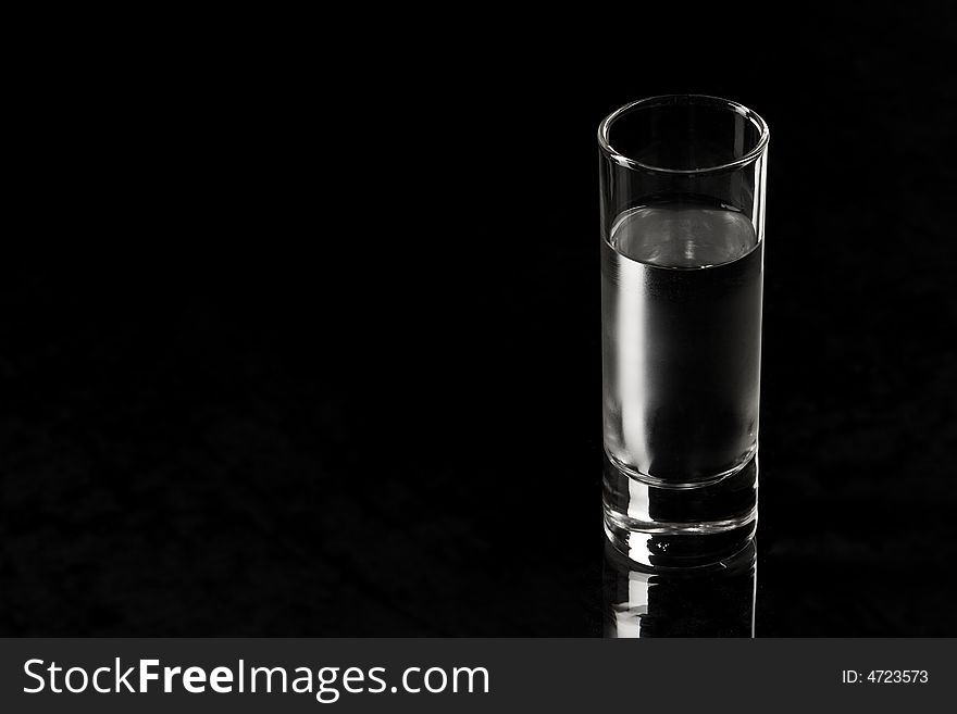 Drink series: glass of Russian vodka over black