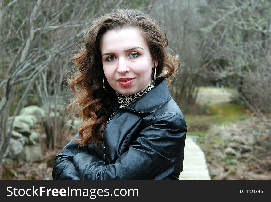 A portrait of a young confident woman looking at the camera. A portrait of a young confident woman looking at the camera.