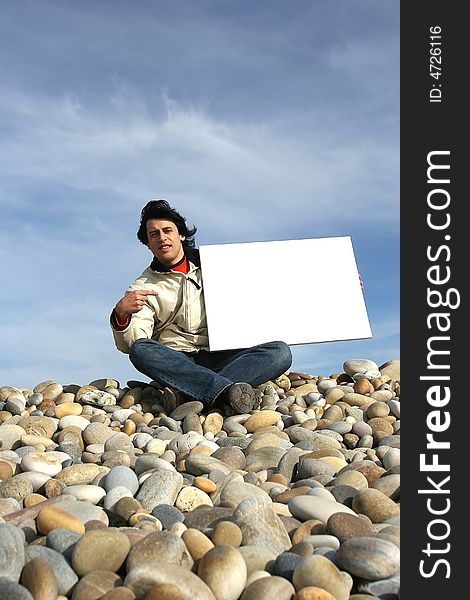Young Man Holding White Card